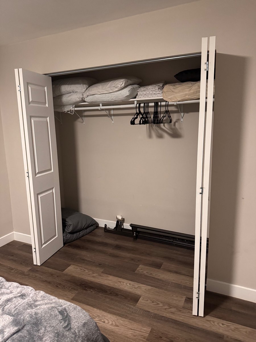Large closet with hangers, extra sheets, extra pillows, and extra blankets. 