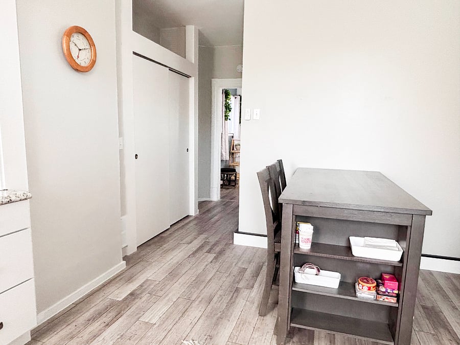Bar height table with large storage in hallway (leading to living room)