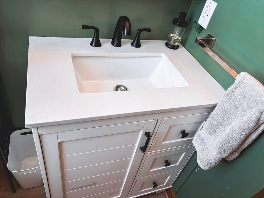 new sink with storage, mirror medicine cabinet, and new fixtures.