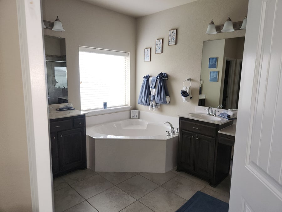 Master bathroom with separate tub and shower.