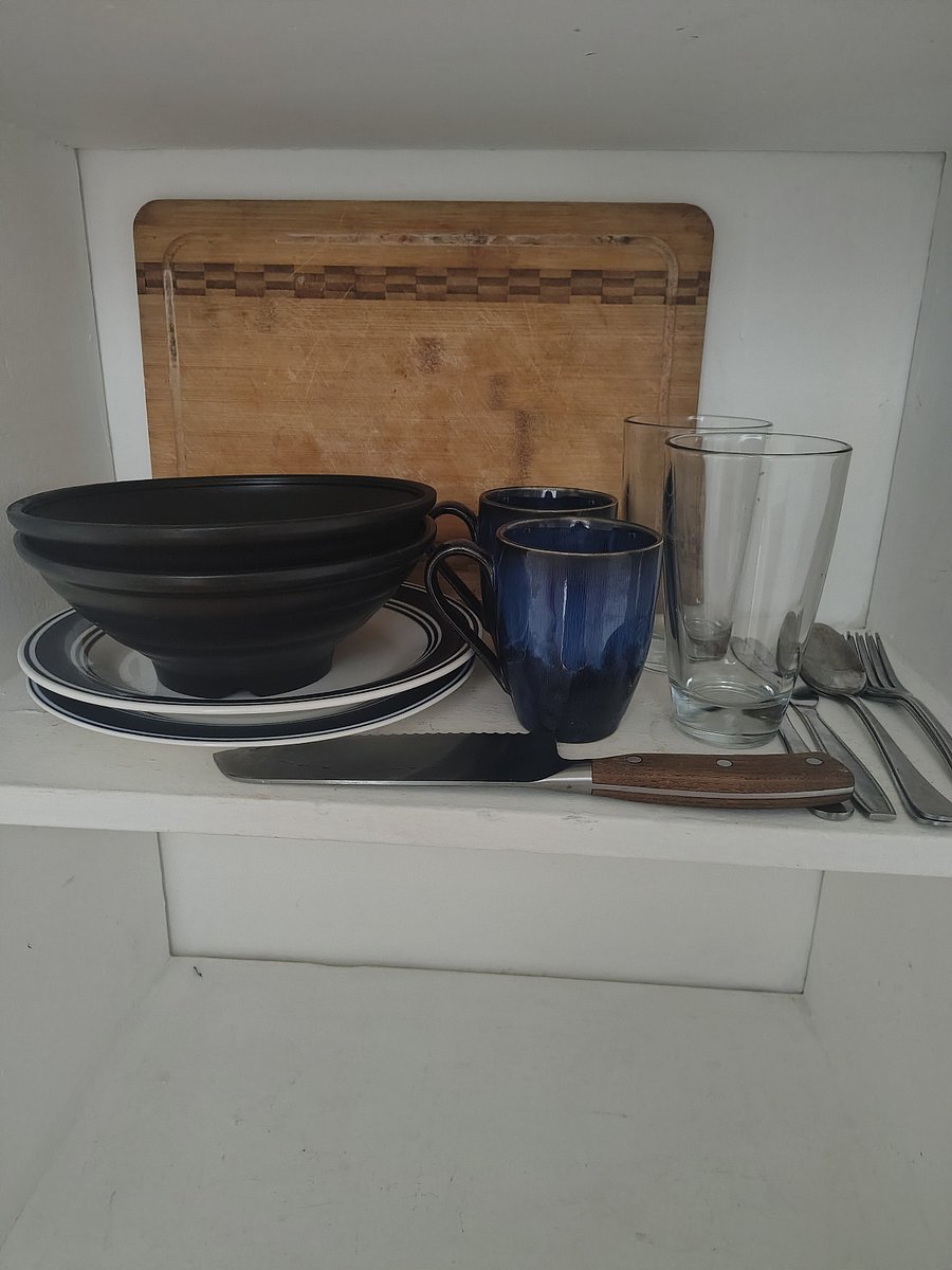 Plates etc are stored in the walk in closet.
