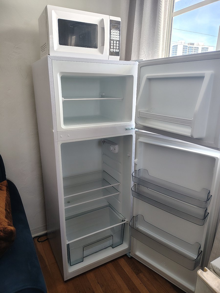 7 cu foot new fridge with freezer.