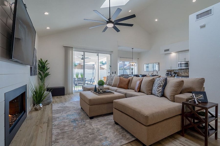 Family room opens to backyard. Double chaise sectional
