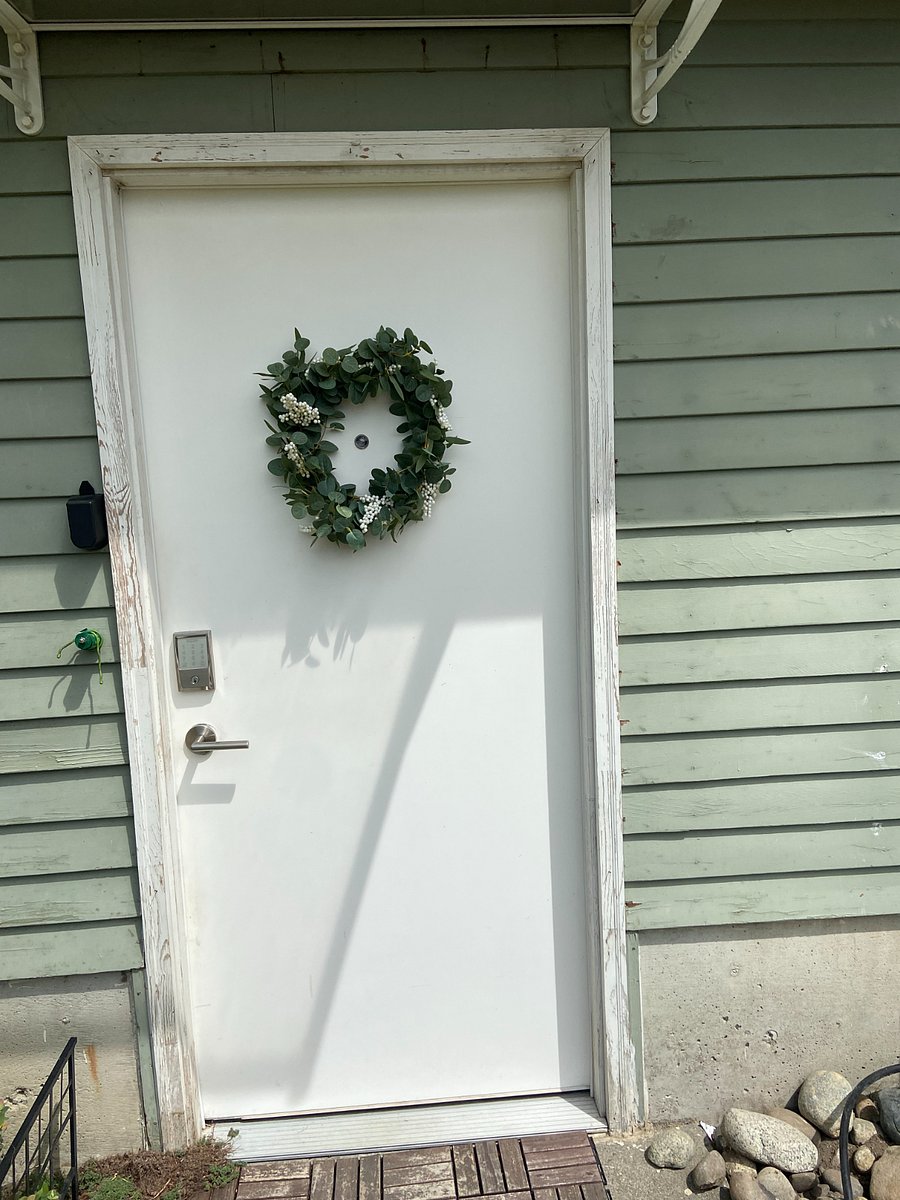 Private entrance from fenced-in/gated backyard. Keycode for easy access. 

Enter into shared storage space that includes a full size refrigerator and could store a bike, camping/hiking supplies. As a bonus there is a dart board off to the far left. 
