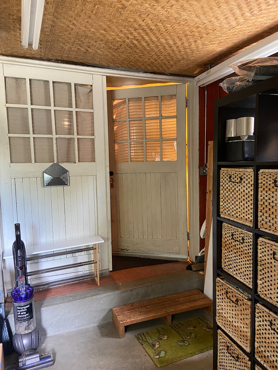 shared space between backdoor and apartment door. There is a work bench/tools, a full size refrigerator (to store overflow food, not pictured but to the left) and extra space to store your bike, camping/hiking equipment or other items. 