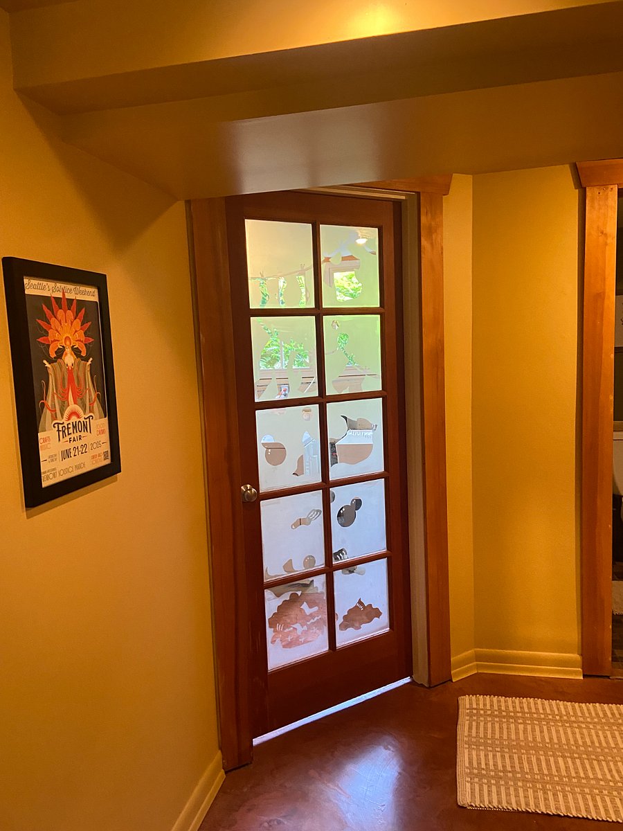 Door to laundry area/kitchen. Bathroom door to the right and living room around the corner to the left. 