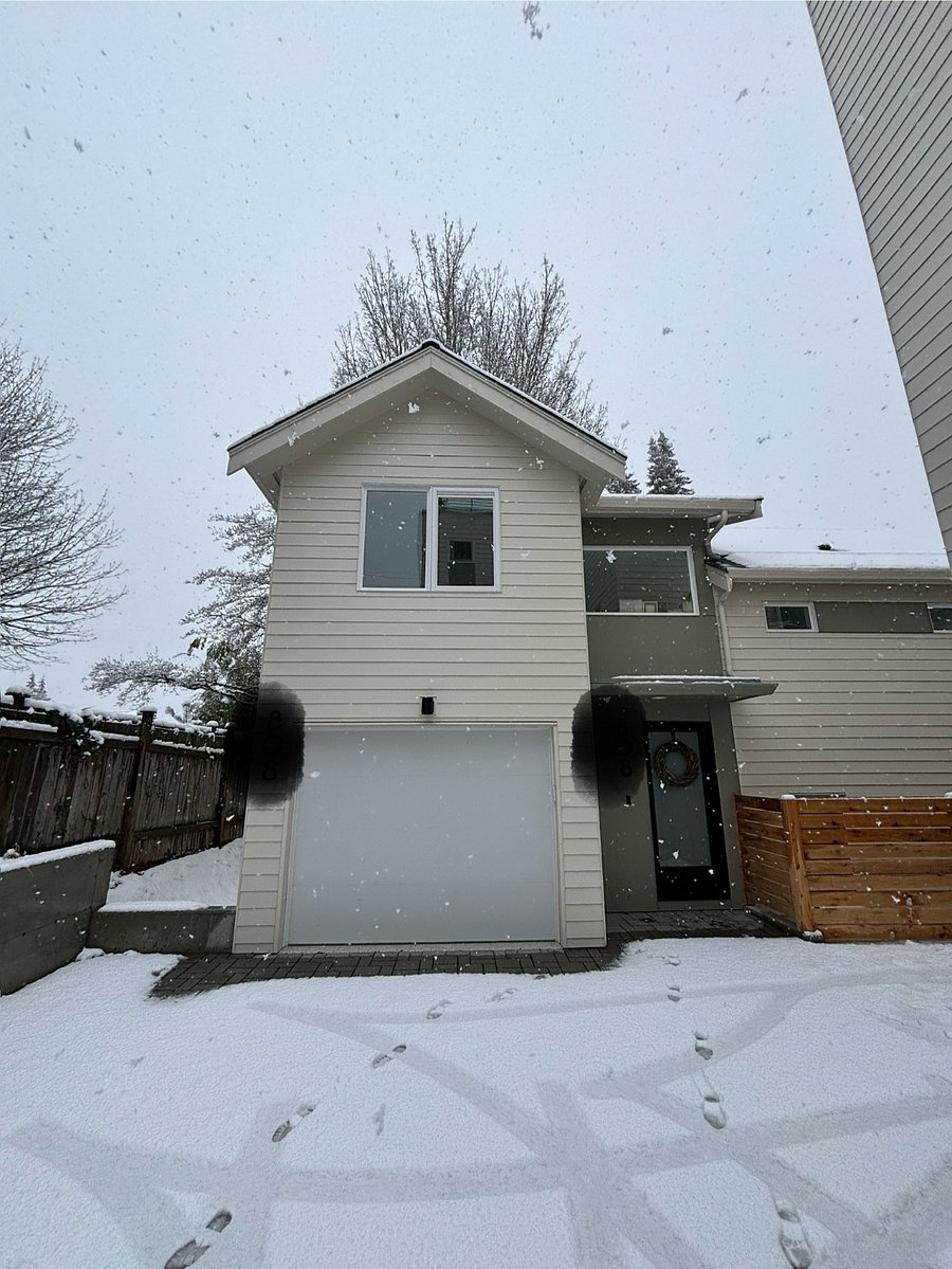Exterior view to entrance. Furnished Finder guest room is the top floor with windows pictured here.