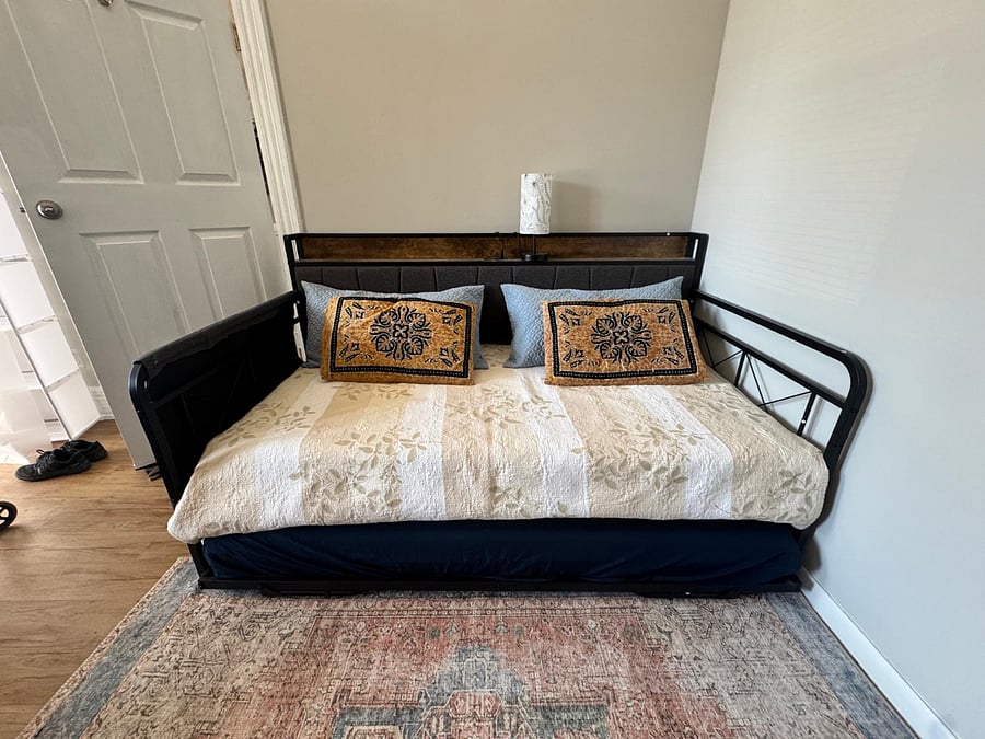 Trundle bed in living room transforms from a sofa to a king size bed or into two twin beds