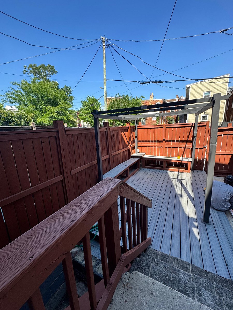 The deck in the fenced-in backyard is the perfect place to relax with lots of seating and an outlet for your laptop!