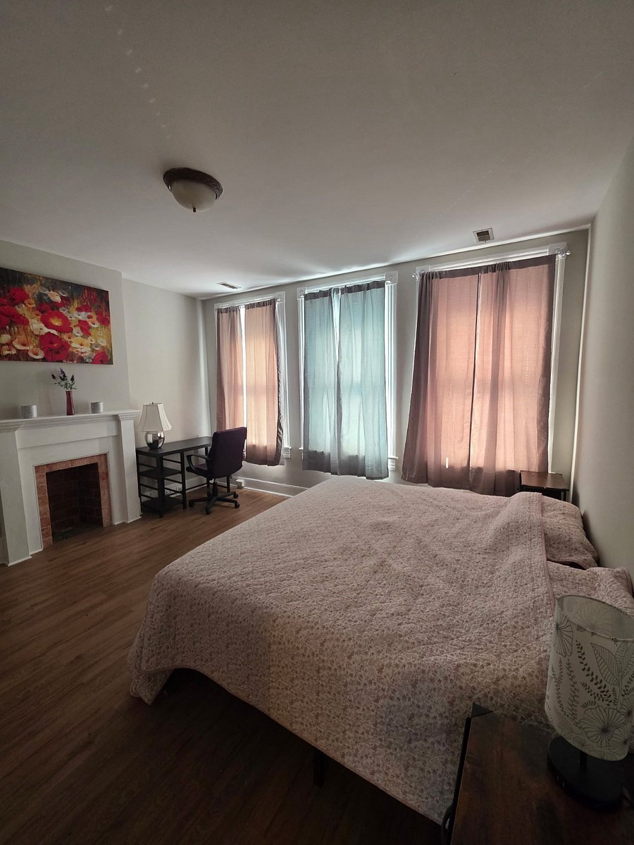 The extra large master bedroom is furnished with a king sized bed.  Three large windows light up the room making it bright and welcoming.  The room darkening shades along with the blinds create a peaceful slumber retreat.   