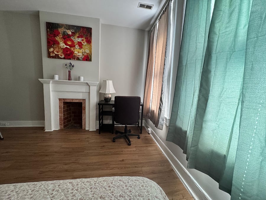 The master bedroom also has a desk with a lamp that makes it a great private office area as well.