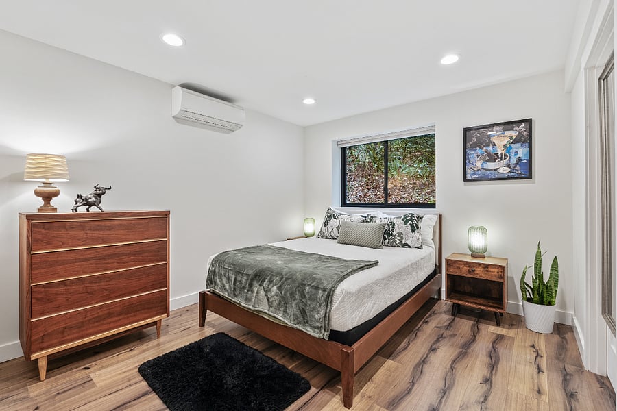 queen bedroom with dresser and closet