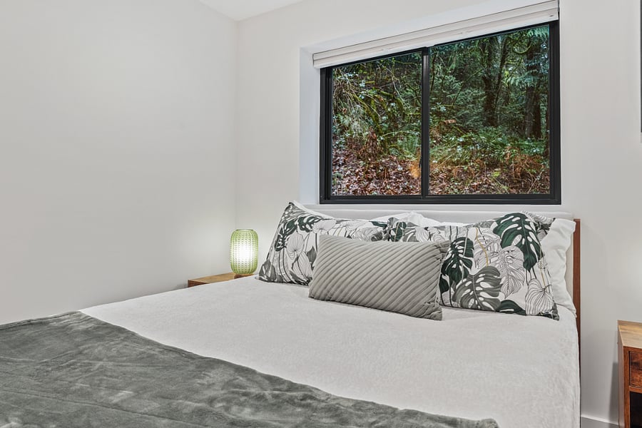 queen bedroom facing the back of the property