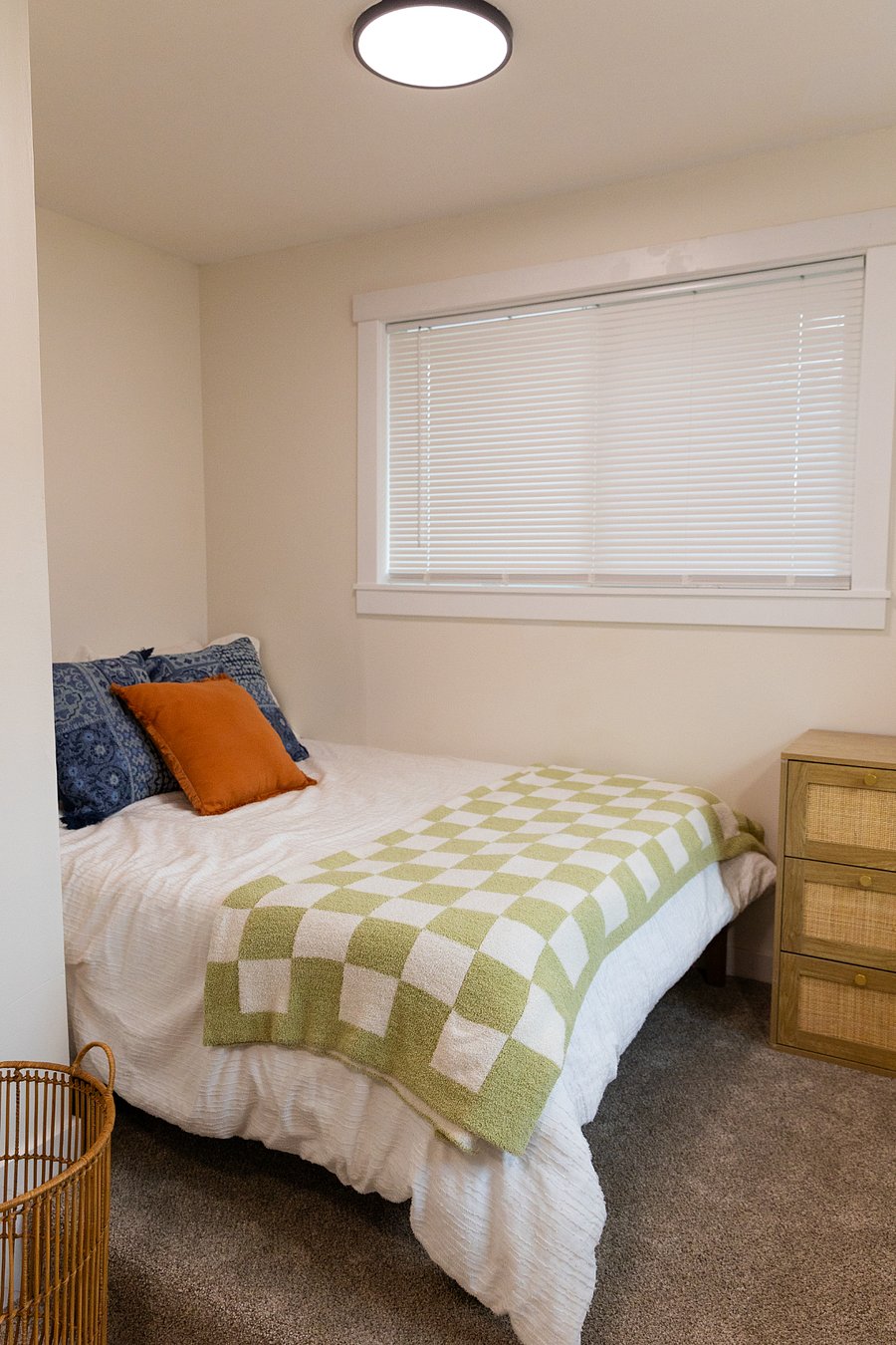 Bedroom #2 - full size bed, has an AC split unit and carpet. 
Has a extra large cubby area for storage, a dresser, and a standing clothing rack with hangers.