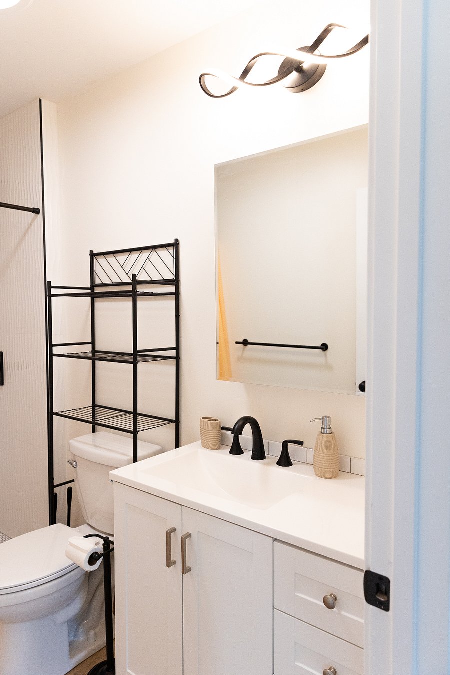 1 bathroom. Storage cabinet inside mirror. 