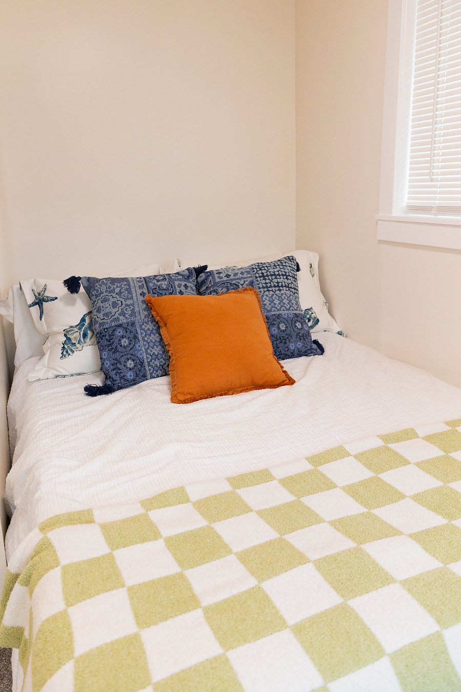 Bedroom #2 - full size bed, has an AC split unit and carpet. 
Has a extra large cubby area for storage, a dresser, and a standing clothing rack with hangers.