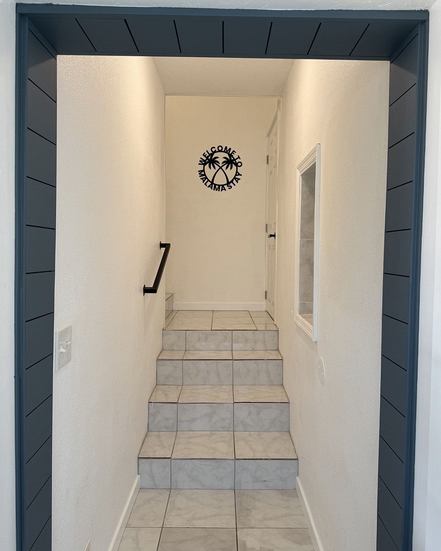 Entrance to unit - a shared hallway up a small set of stairs leads to your unit's (soundproof) door.