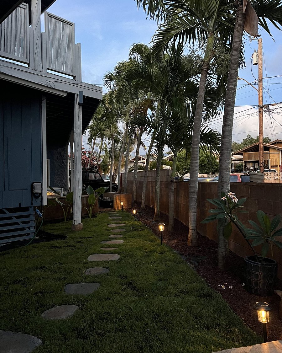 Front yard which leads to a shared outdoor laundry area - 2 washers & 2 dryers. & outdoor hose for washing off sand after beach.