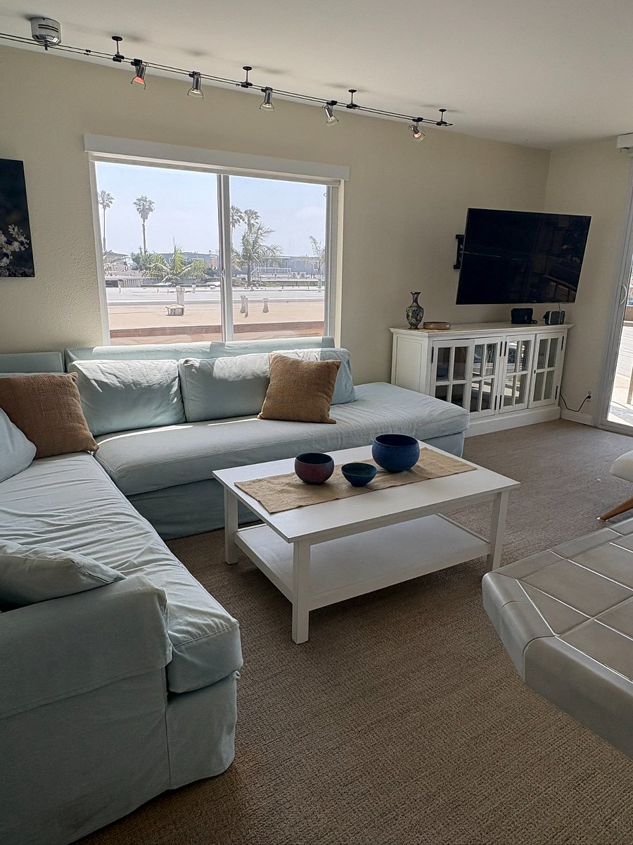 Many large windows flood living room with natural light