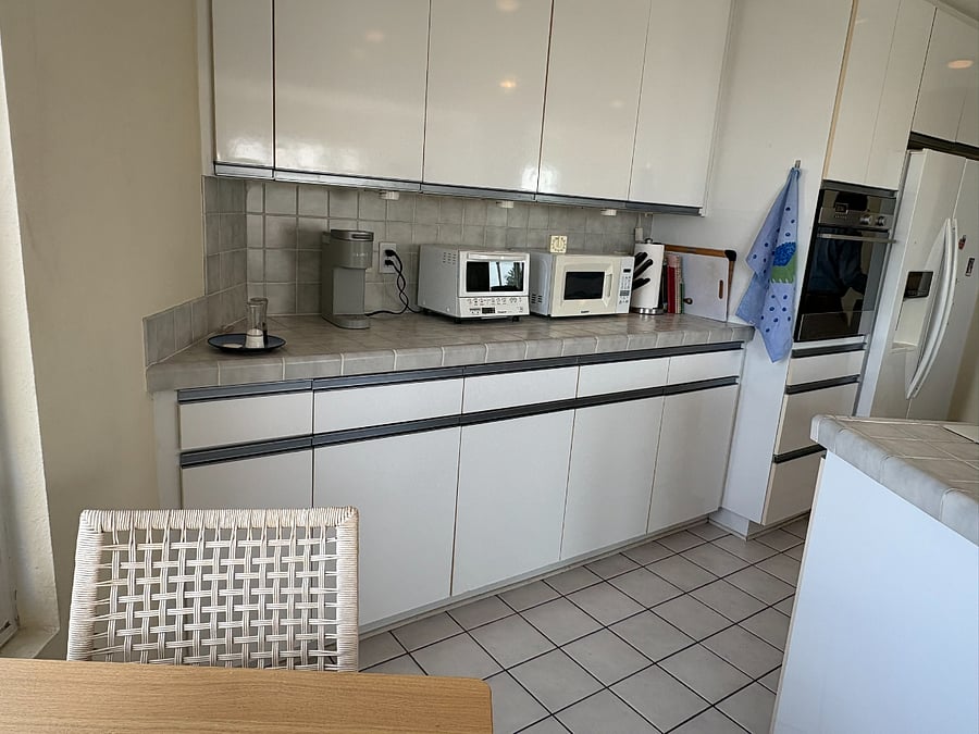 Kitchen is well appointed with full-size fridge (with ice and water dispenser), Fisher & Paykel oven and dishwasher, Keurig coffee maker, microwave, toaster oven, etc.