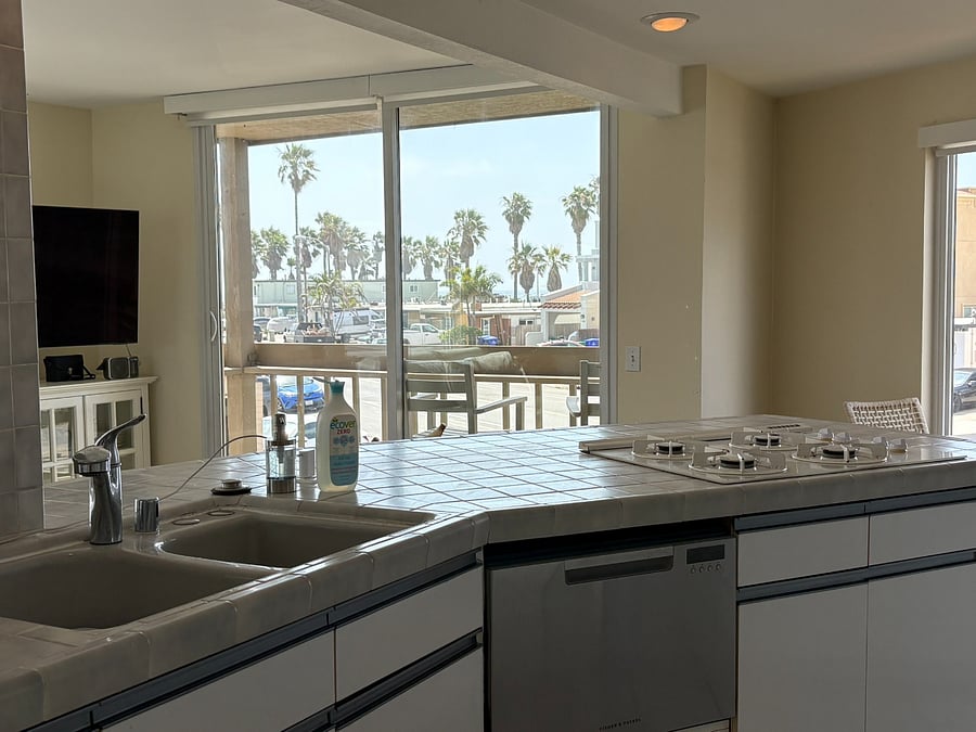 Large kitchen opens to living room to maximize light and comfort 