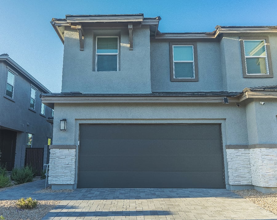 Modern North Phoenix home with a spacious garage, bright entryway, and inviting front porch.