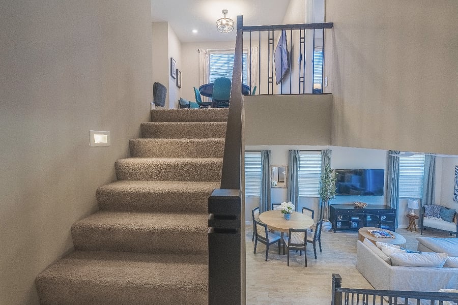 Open-concept layout with an inviting loft upstairs and bright, spacious living and dining areas below.