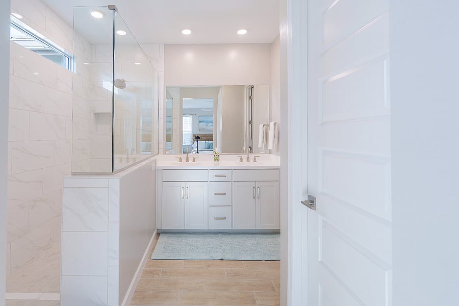 Private primary full bathroom with double sinks, walk-in shower, and toilet closet.