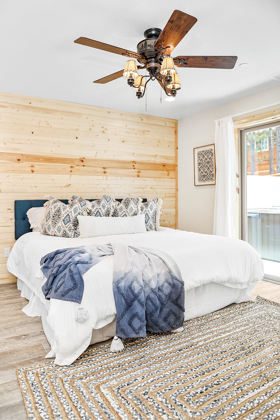 Primary bedroom opens to the fenced in backyard.