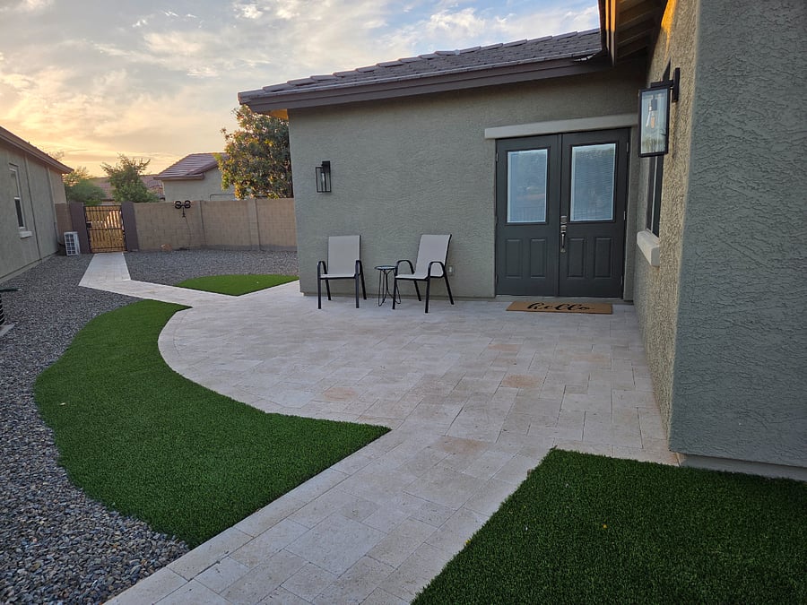 Private gated entrance with dedicated patio and outdoor seating.