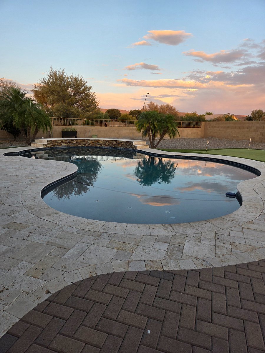 Enjoy access to the shared backyard oasis featuring a seasonal pool and peaceful desert sunsets.