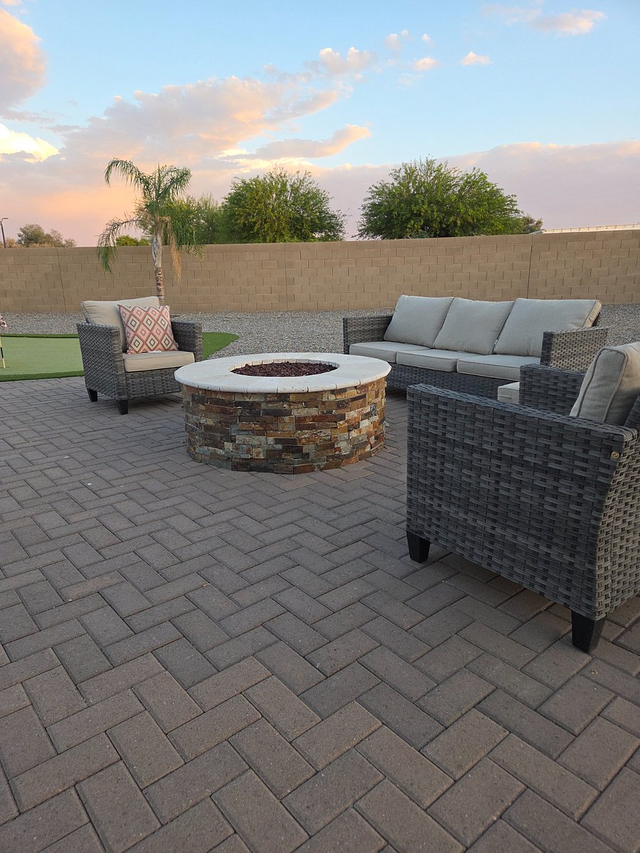 Unwind outdoors with comfortable seating, a fire pit, and putting green access.