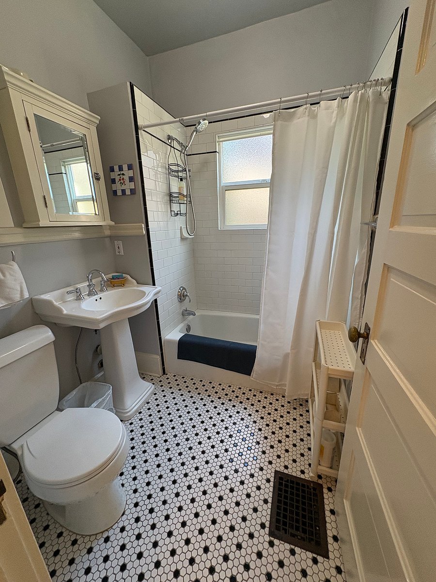 Bathroom with tub and tile shower