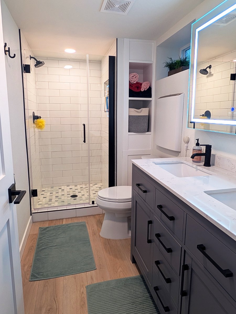 Downstairs full bathroom with walk-in shower and double vanity