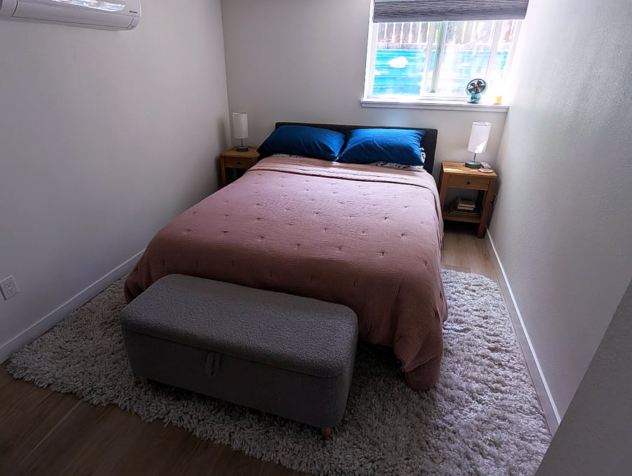 Bedroom with queen bed and storage bench