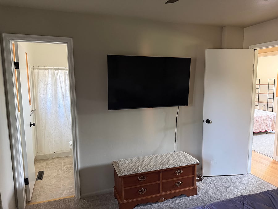 Main bedroom - queen sized bed, closet organizer, smart TV