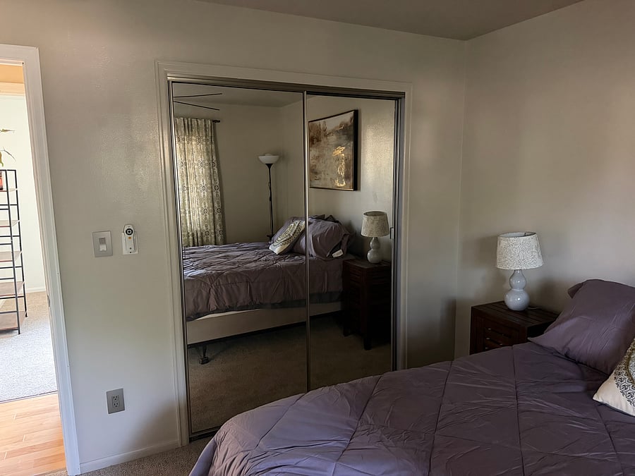Main bedroom - queen sized bed, closet organizer, smart TV