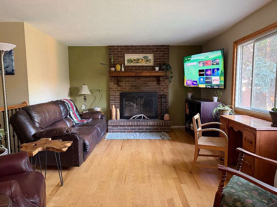 Living room: couch, recliner, desk, rocking chairs, Smart TV, open