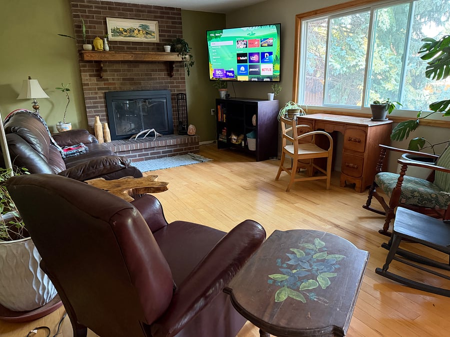 Living room: couch, recliner, desk, rocking chairs, Smart TV, open