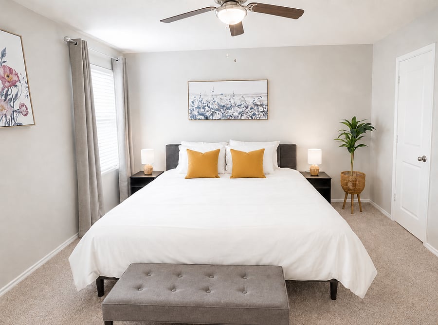 Bedroom 1 - Spacious King bedroom with soft lighting and comfortable bedding