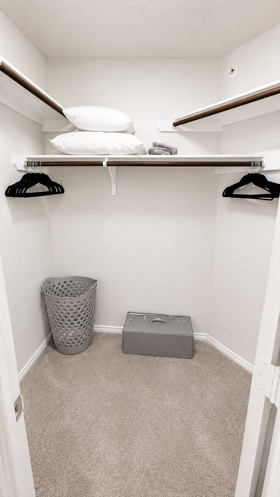 Bedroom 1 - Walk-in closet with hangers and luggage storage space