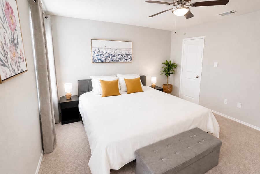 Bedroom 1 - Spacious King bedroom with soft lighting, comfortable bedding, a smart TV and a walk-in closet