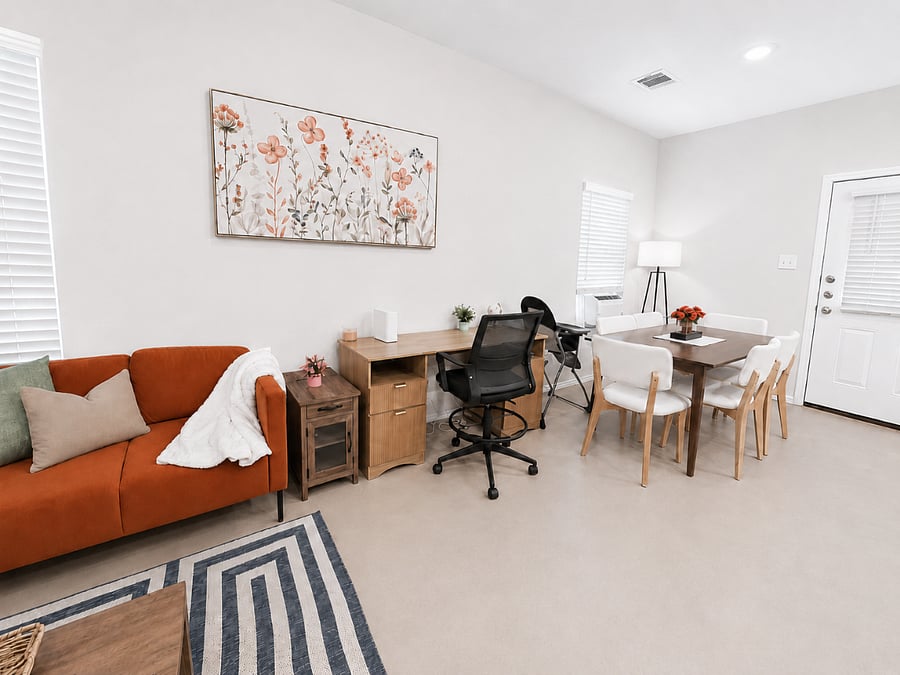 Open concept living room with dinning area and a work desk