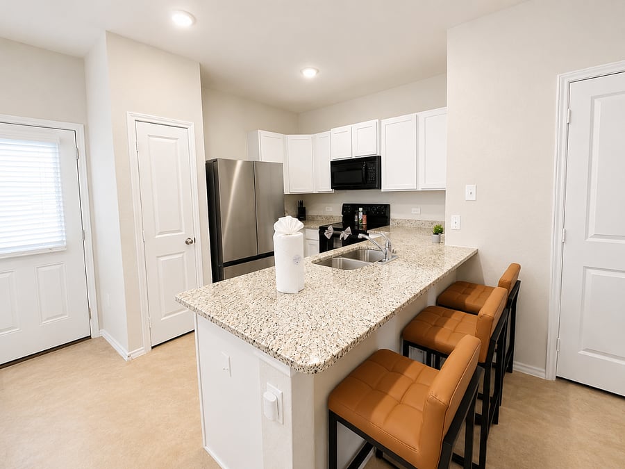 Fully stocked kitchen with modern appliances and spacious island seating for group meals