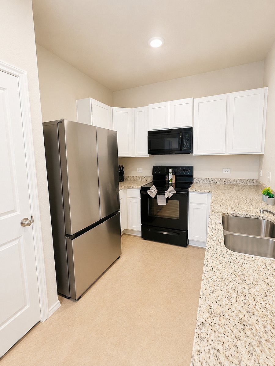 Fully stocked kitchen with modern appliances and spacious island seating for group meals