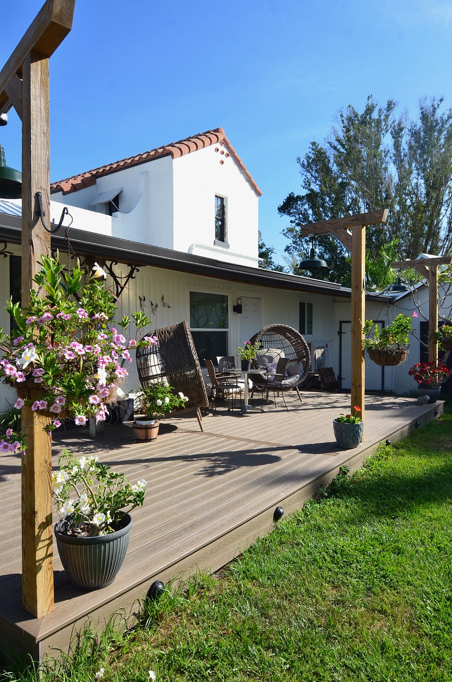 Large covered porch deck with outdoor seating