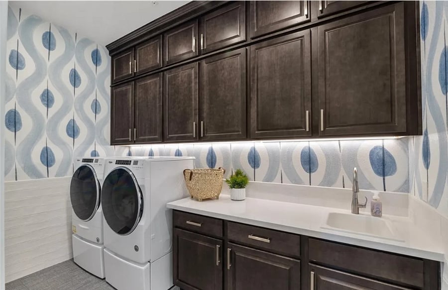 Large laundry room available for use any time with iron, ironing board, and clothes steamer.