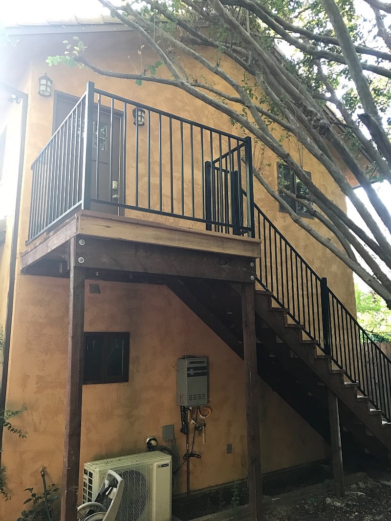 Private balcony looks out over backyard.