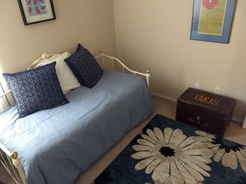 Your bedroom with a comfortable twin bed, nightstand, dresser, closet, ceiling fan, towels, and new linens.